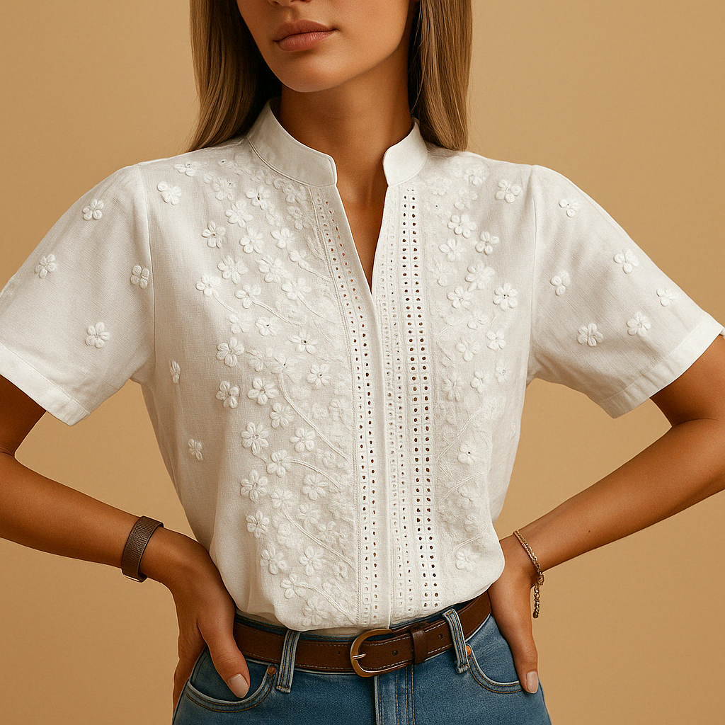 White elegant blouse for women with a classic collar and button closure, perfect for work, casual wear, and evening outings.