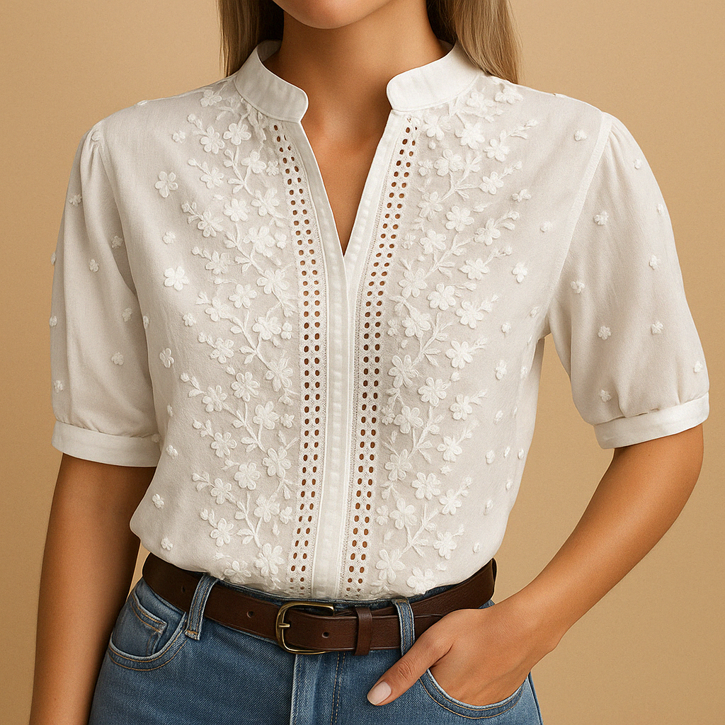 White elegant blouse for women with a classic collar and button closure, perfect for work, casual wear, and evening outings.